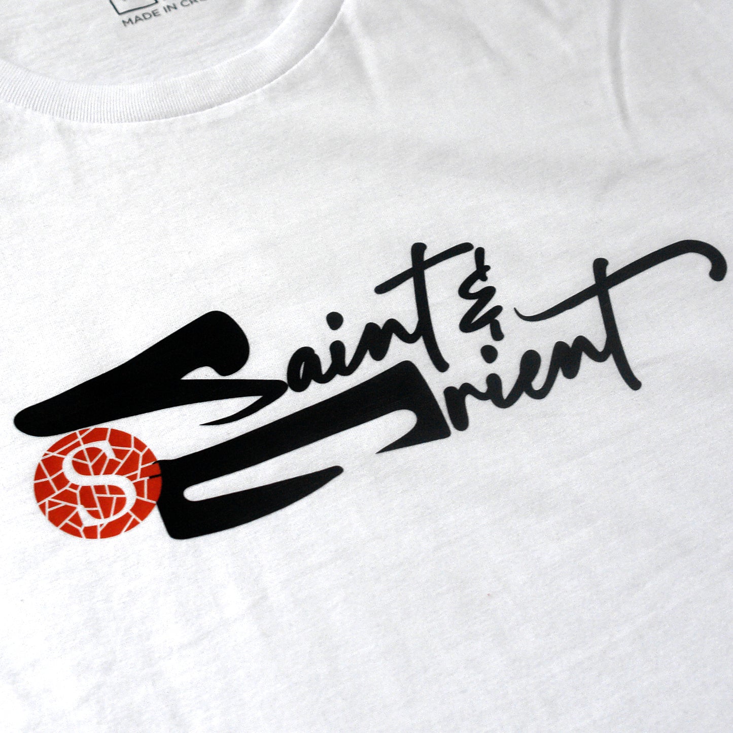Loose calligraphy graphic on white Saint&Orient tee