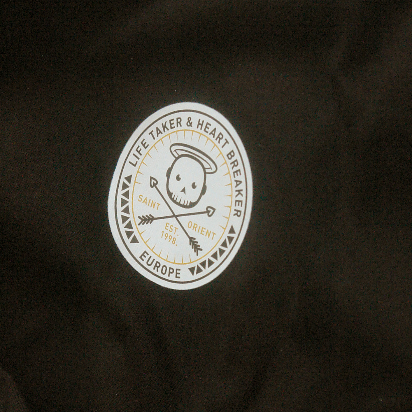 Black oversized t-shirt with Life Taker Heart Breaker circular badge logo
