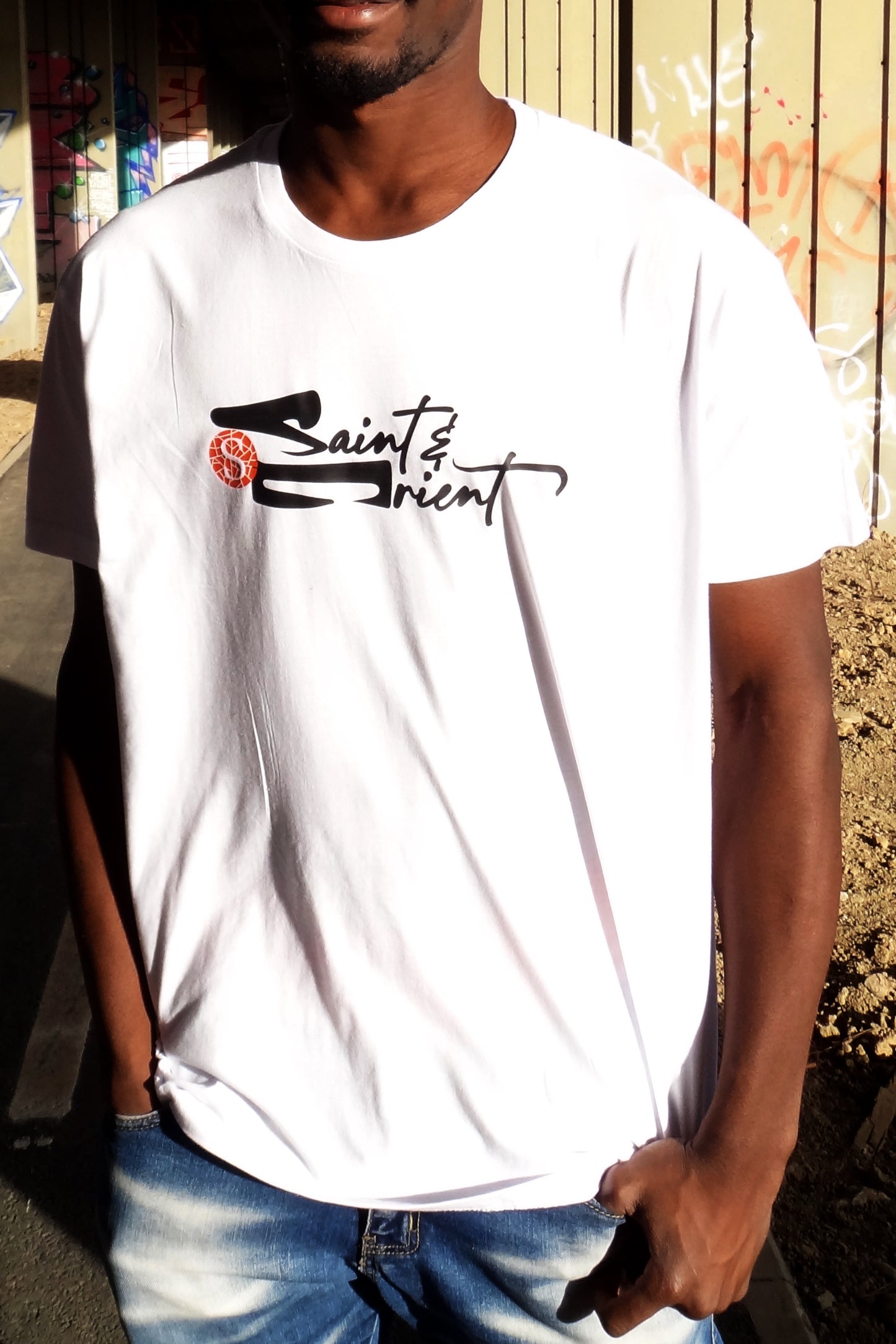 Loose calligraphy graphic on white Saint&Orient tee
