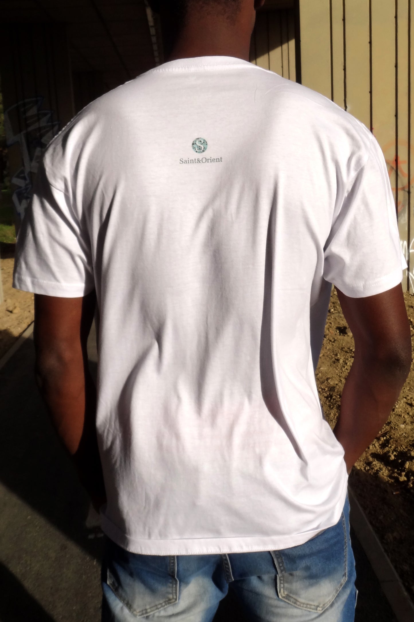 Loose calligraphy graphic on white Saint&Orient tee