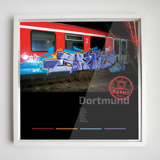Saint purple graffiti on Dortmund S-bahn in the night